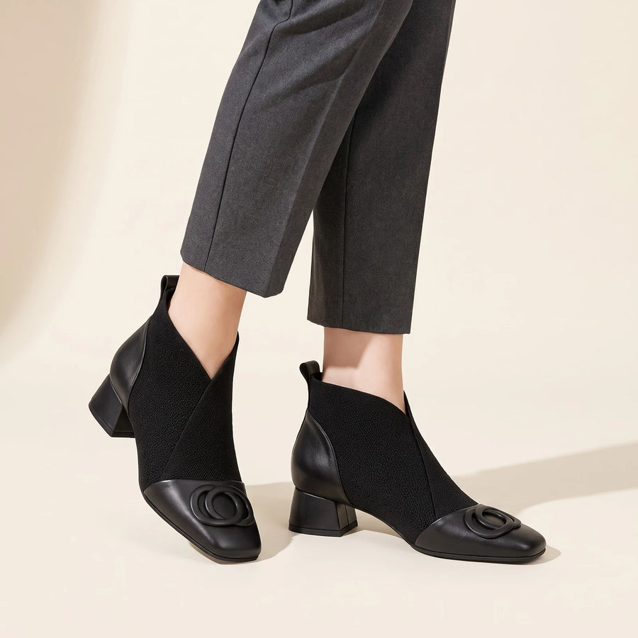 Delphine Square Toe Block Heel Ankle Boots in Black, worn with cropped trousers