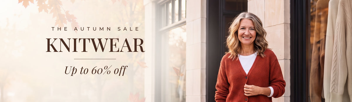 The Autumn Sale: Knitwear, up to 60% off. Mae in front of the Linden & Mae boutique.