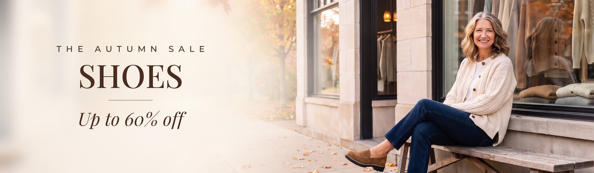 The Autumn Sale: Shoes, up to 60% off. Mae in front of the Linden & Mae boutique.